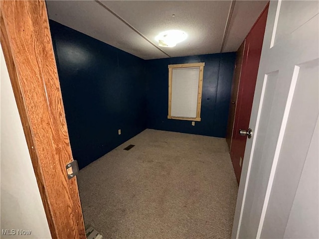 empty room featuring light colored carpet