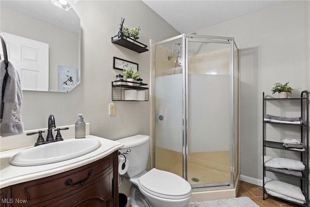 bathroom featuring walk in shower, vanity, and toilet