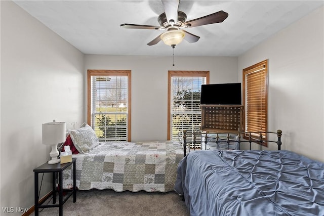 bedroom with ceiling fan and carpet