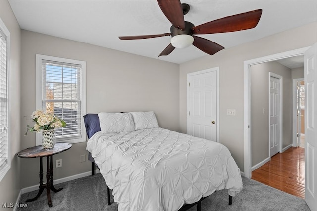 carpeted bedroom featuring ceiling fan