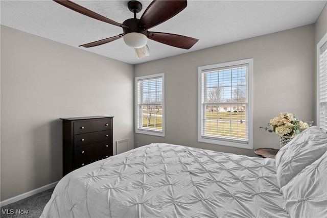 carpeted bedroom featuring ceiling fan