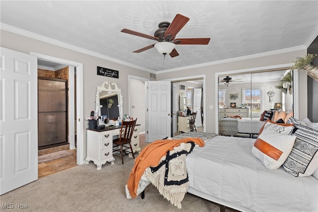 bedroom with crown molding, carpet flooring, ensuite bathroom, and ceiling fan