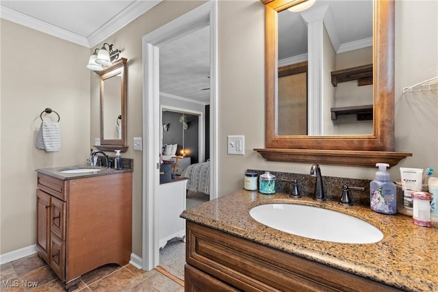 bathroom with tile patterned flooring, vanity, and ornamental molding