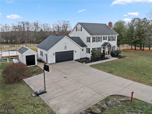 view of front of home featuring a shed and a front lawn