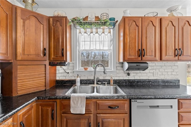 kitchen with dishwasher, sink, and backsplash