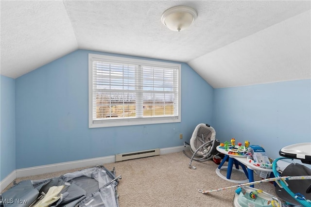 recreation room with carpet floors, vaulted ceiling, a textured ceiling, and a baseboard heating unit