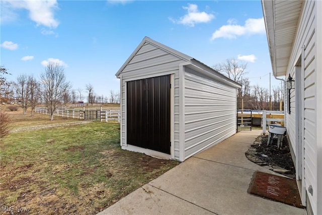 view of outbuilding with a lawn