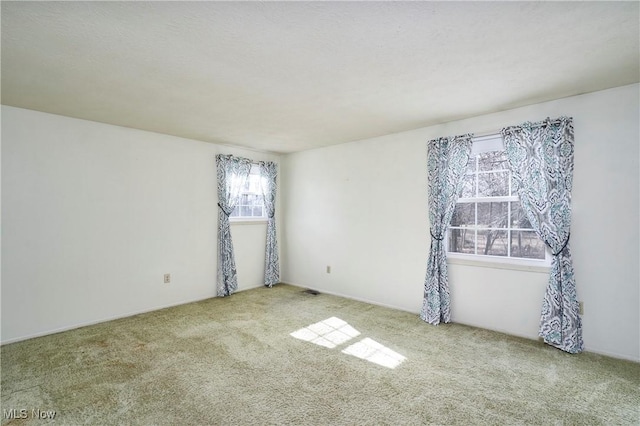 empty room with carpet flooring