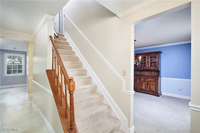 stairway featuring tile patterned flooring and crown molding