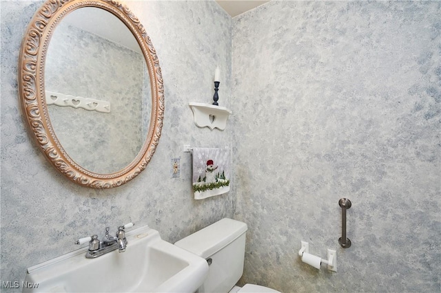 bathroom with sink and toilet