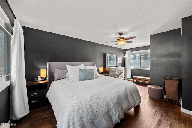 bedroom featuring dark wood-type flooring and ceiling fan