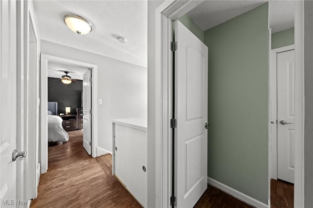 hallway featuring dark hardwood / wood-style floors