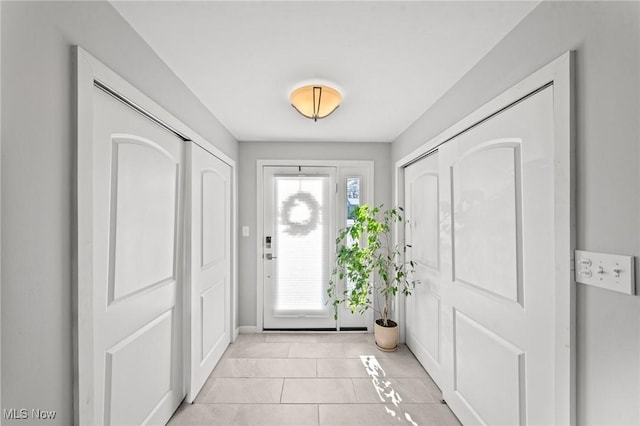 foyer with light tile patterned floors