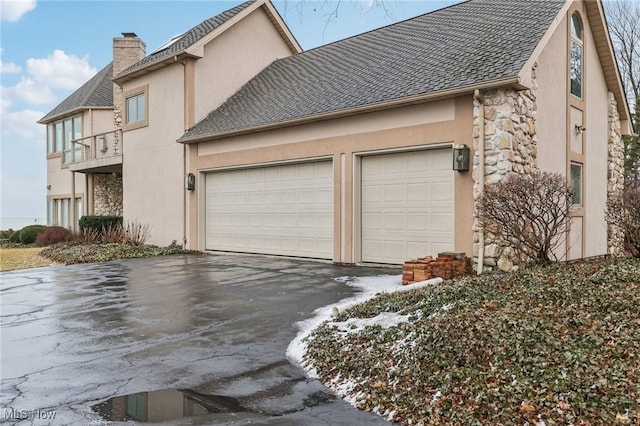 view of side of property with a garage