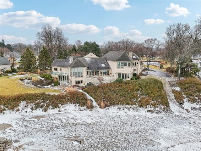 view of snow covered house