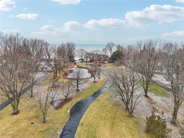 view of property's community with a yard