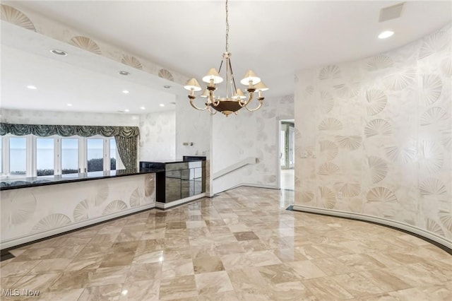 kitchen with an inviting chandelier, decorative light fixtures, and a wealth of natural light