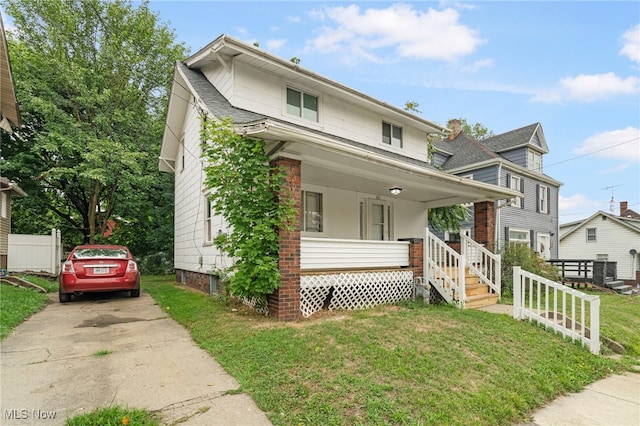 view of front facade with a porch and a front yard