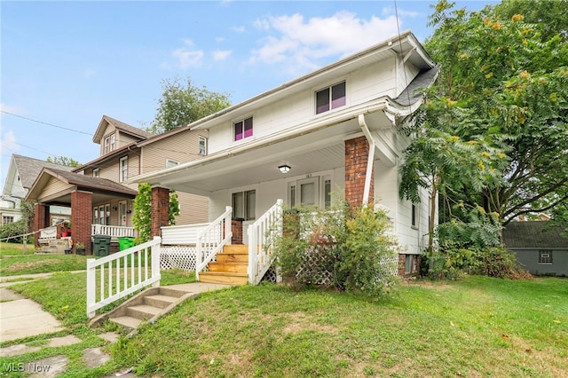 view of front of property featuring a porch and a front yard