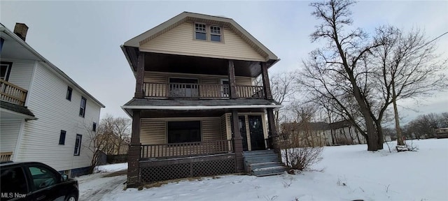 view of front of home featuring a balcony