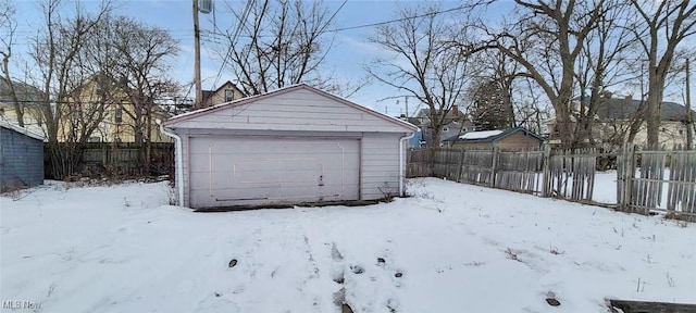 view of snow covered garage