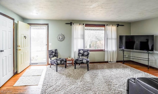 interior space with hardwood / wood-style flooring and a textured ceiling