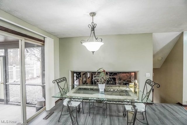 dining space featuring wood-type flooring