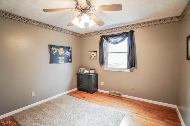 unfurnished room featuring wood-type flooring and ceiling fan