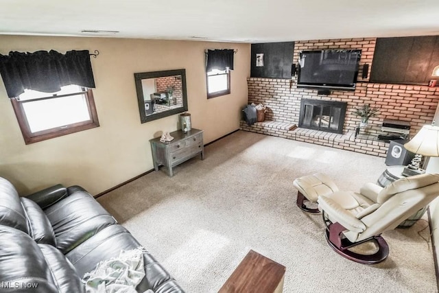 carpeted living room featuring a fireplace