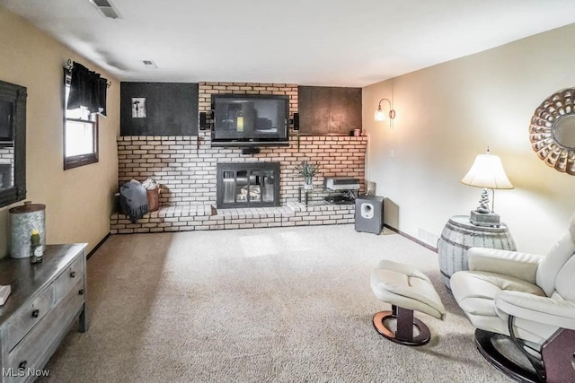 living room featuring a brick fireplace and carpet flooring