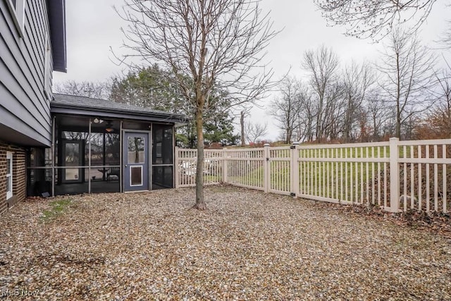 view of yard with a sunroom