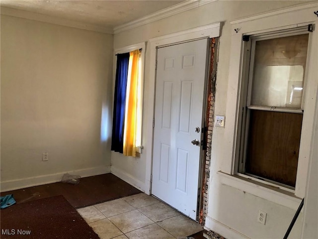 tiled foyer with ornamental molding