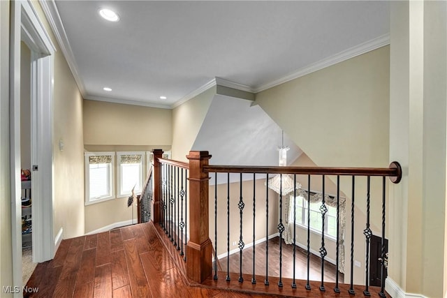 stairs with crown molding and hardwood / wood-style floors