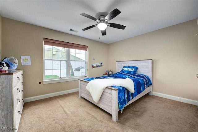 bedroom with light carpet and ceiling fan