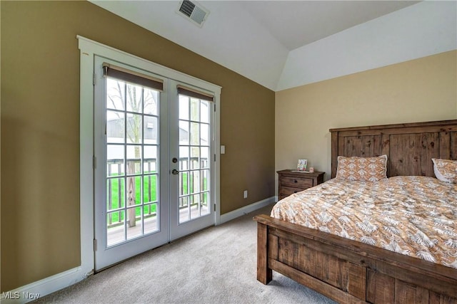 carpeted bedroom featuring lofted ceiling, access to exterior, and french doors