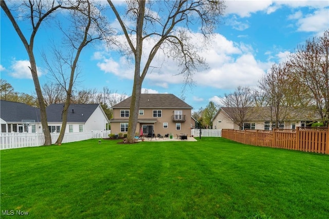 back of house featuring a yard, a patio, and an AC wall unit