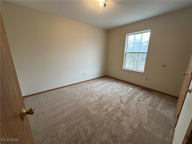 spare room with carpet flooring