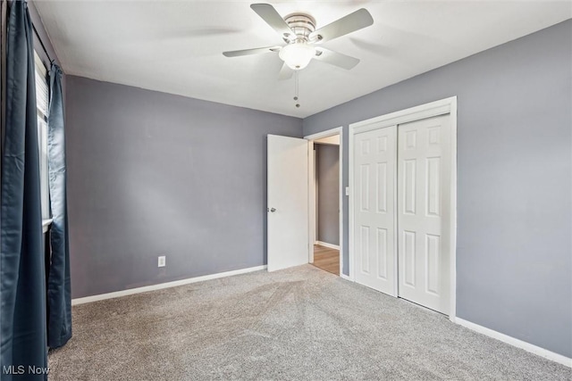 unfurnished bedroom featuring carpet flooring, ceiling fan, and a closet