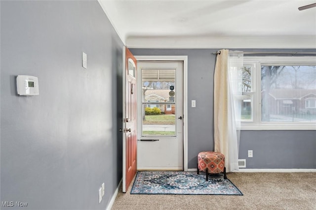 doorway with carpet floors