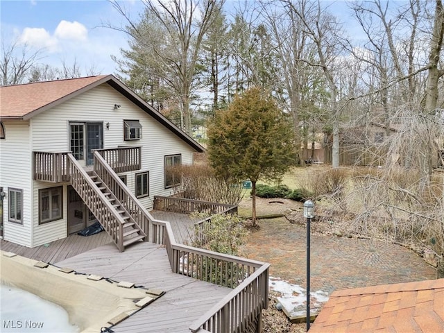 back of property featuring a wooden deck