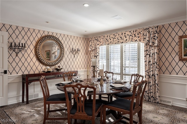 dining area featuring crown molding