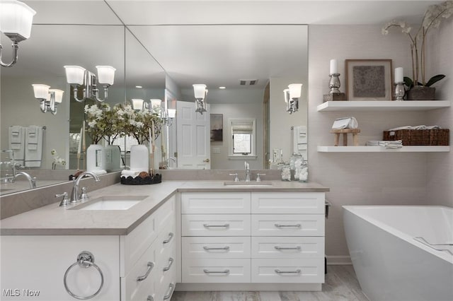 bathroom featuring vanity and a tub