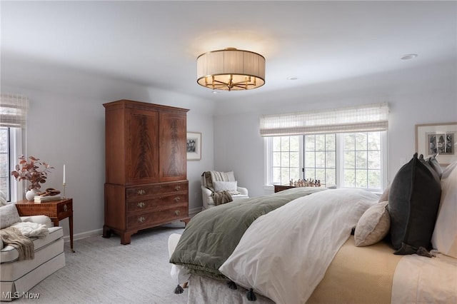 bedroom with light carpet