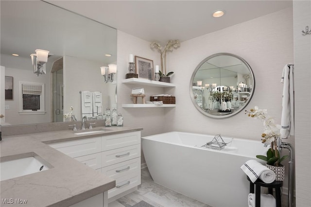 bathroom featuring vanity and a bathing tub