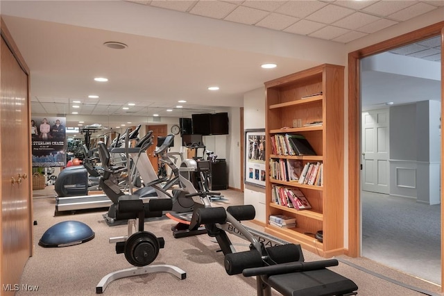 exercise area featuring light colored carpet