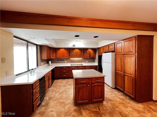 kitchen featuring sink, a center island, white refrigerator, gas cooktop, and dishwasher