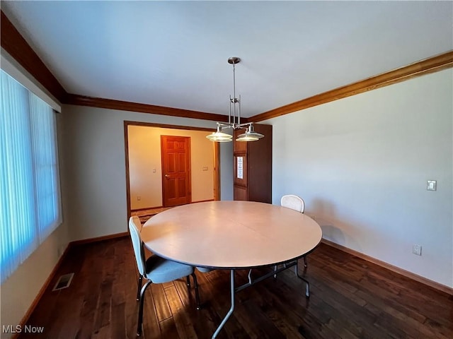 unfurnished dining area featuring dark wood-type flooring and ornamental molding