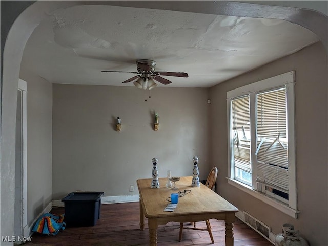 dining room featuring dark hardwood / wood-style floors and ceiling fan