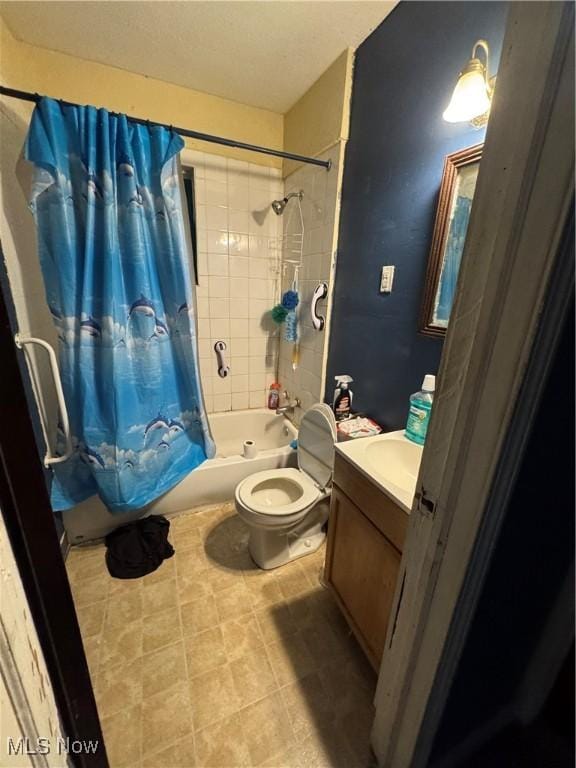 full bathroom with vanity, shower / bath combination with curtain, and toilet