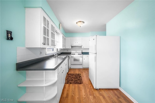 kitchen featuring sink, white cabinets, white appliances, and light hardwood / wood-style floors